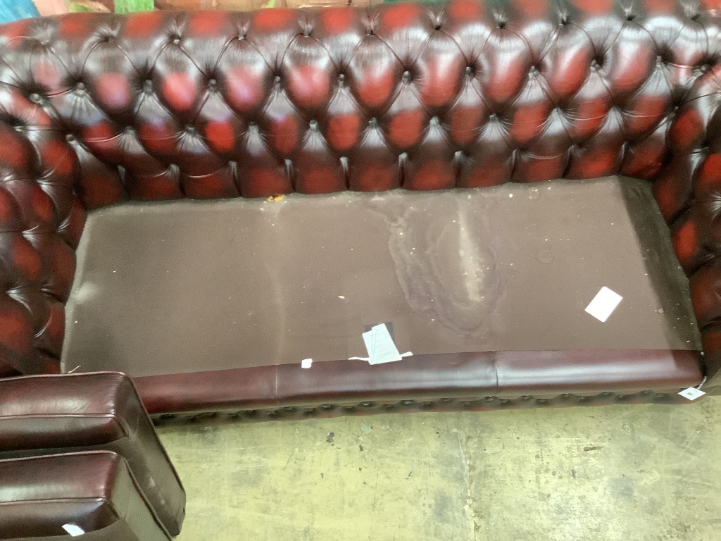 A Victorian style buttoned burgundy leather three seater Chesterfield settee, width 200cm depth 84cm height 72cm